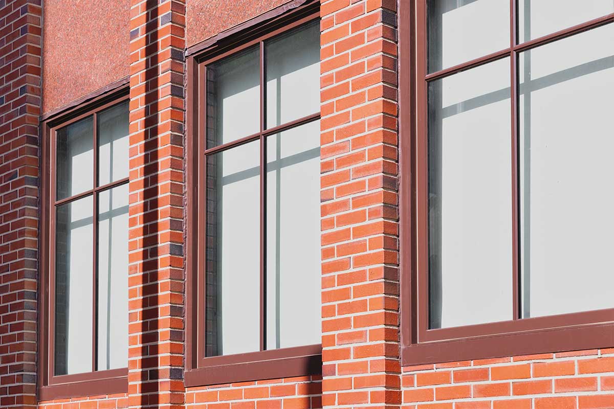 A close-up of Christ Episcopal Church's Marvin Ultimate Venting Picture windows on the exterior of the parish hall.