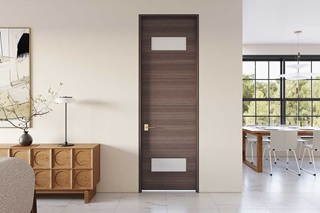 A living room with mid-century modern furniture and a dark brown TruStile door.