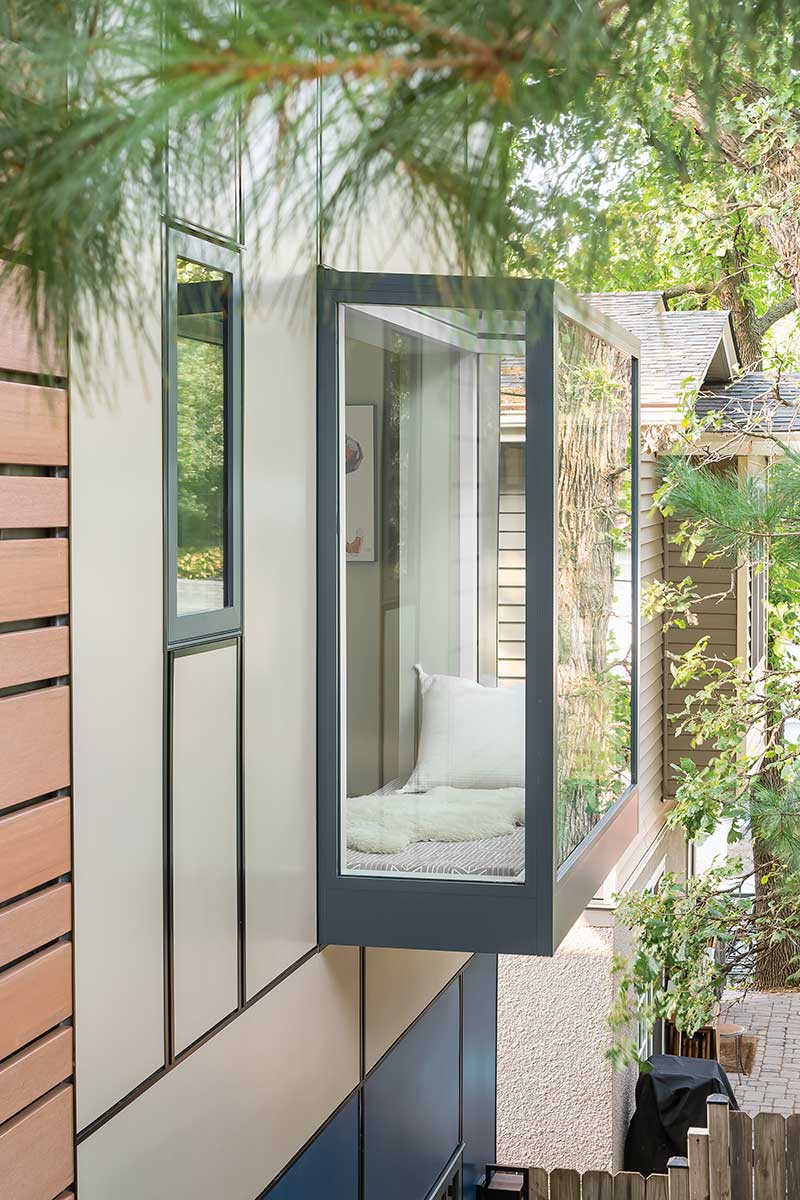 A Marvin Skycove amid white pine boughs in Minneapolis home