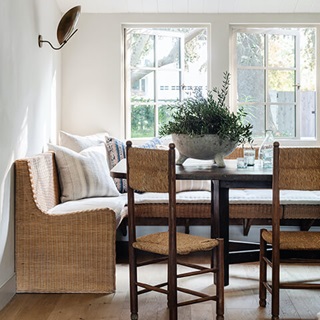 Amber Lewis’s custom bench seating in her kitchen next to Marvin windows.