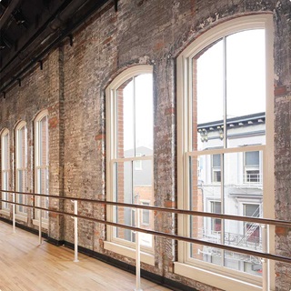 Interior of historic building with Marvin Ultimate Double Hung Round Top Magnum Windows